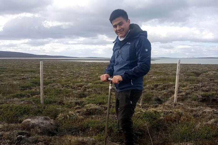 Abdubakir Kushbokov taking soil samples